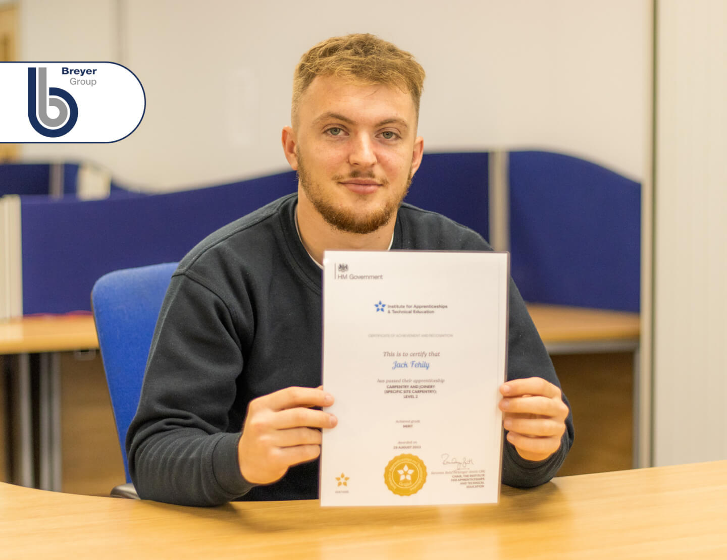 Carpenter apprentice holding certificate